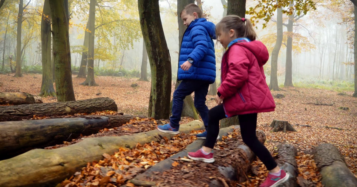 Children walking in the woods wearing the iGPS Wizard Watch